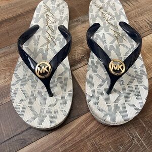 Michael Kors Navy and White  Strappy Flip Flops with Gold MK Emblems
